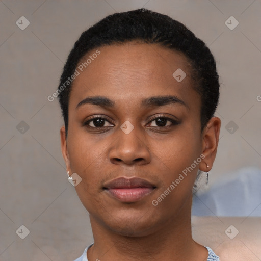 Joyful black young-adult female with short  black hair and brown eyes