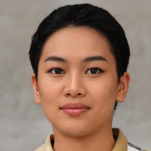 Joyful asian young-adult female with short  black hair and brown eyes