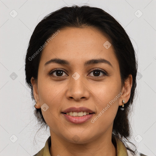 Joyful latino young-adult female with medium  brown hair and brown eyes