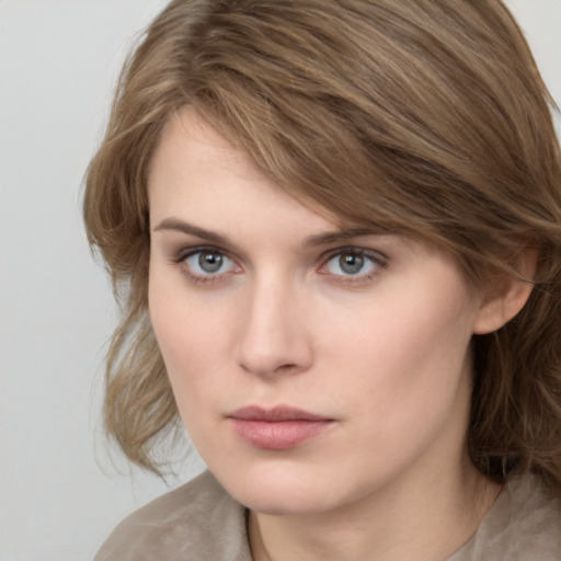 Neutral white young-adult female with medium  brown hair and grey eyes