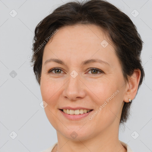 Joyful white adult female with short  brown hair and brown eyes