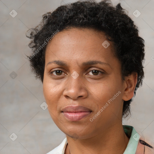 Joyful black adult female with short  brown hair and brown eyes