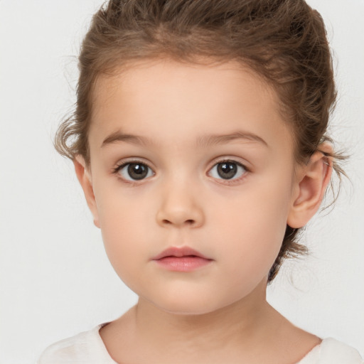 Neutral white child female with short  brown hair and brown eyes