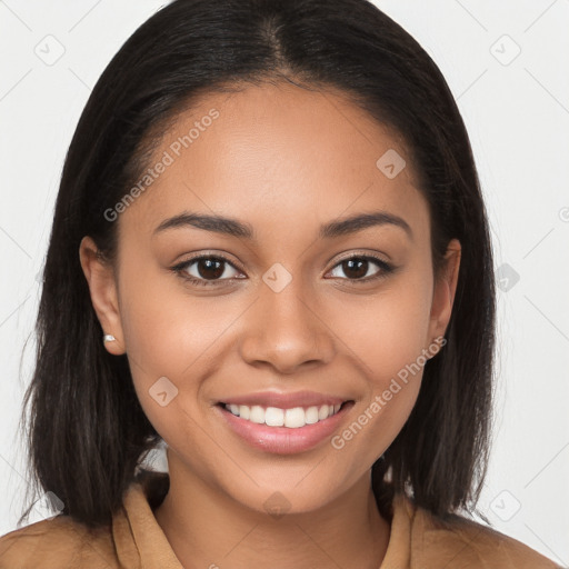 Joyful latino young-adult female with long  brown hair and brown eyes