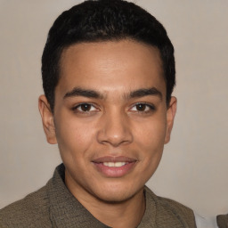 Joyful white young-adult male with short  black hair and brown eyes