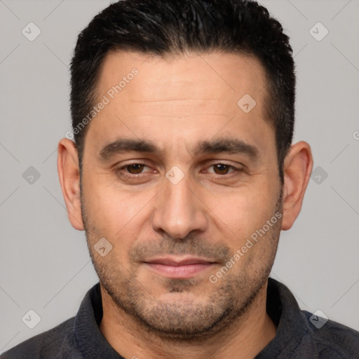 Joyful white young-adult male with short  black hair and brown eyes