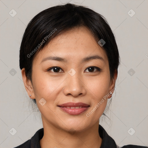 Joyful asian young-adult female with medium  black hair and brown eyes