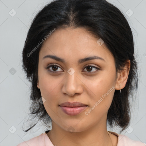 Joyful latino young-adult female with medium  brown hair and brown eyes