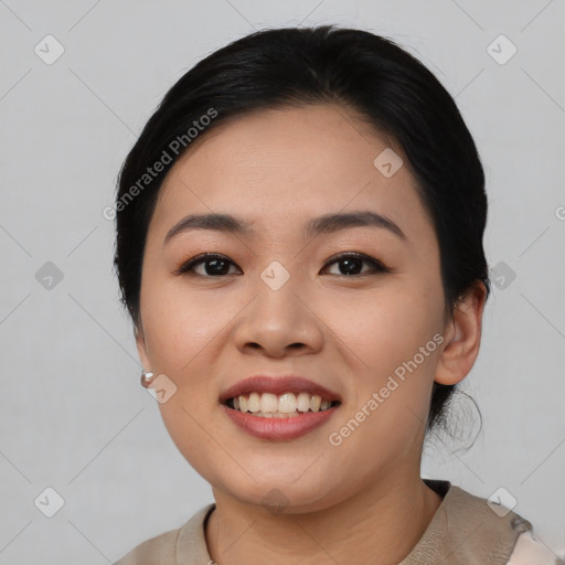 Joyful asian young-adult female with short  black hair and brown eyes