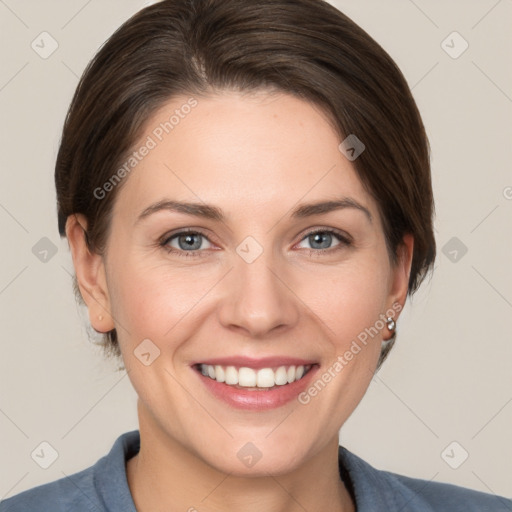 Joyful white young-adult female with short  brown hair and grey eyes