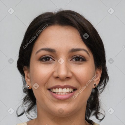 Joyful latino young-adult female with medium  brown hair and brown eyes