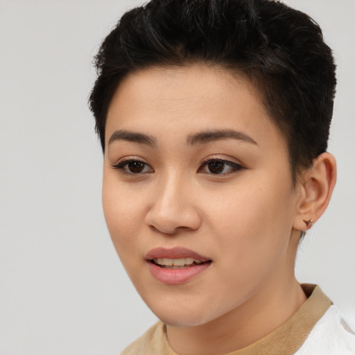 Joyful asian young-adult female with short  brown hair and brown eyes