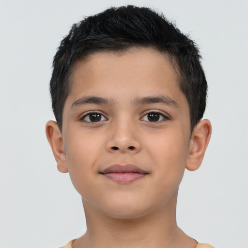 Joyful asian child male with short  brown hair and brown eyes