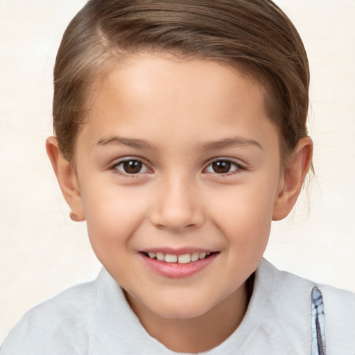 Joyful white child female with short  brown hair and brown eyes