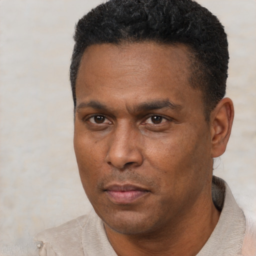 Neutral black adult male with short  black hair and brown eyes