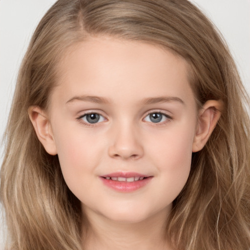 Joyful white child female with long  brown hair and brown eyes