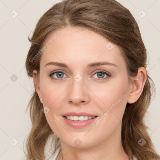 Joyful white young-adult female with medium  brown hair and blue eyes