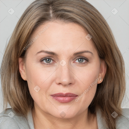 Joyful white adult female with medium  brown hair and grey eyes