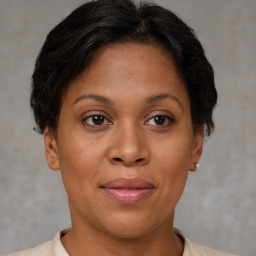 Joyful white adult female with short  brown hair and brown eyes