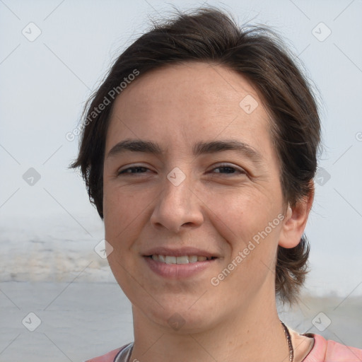 Joyful white adult female with short  brown hair and brown eyes