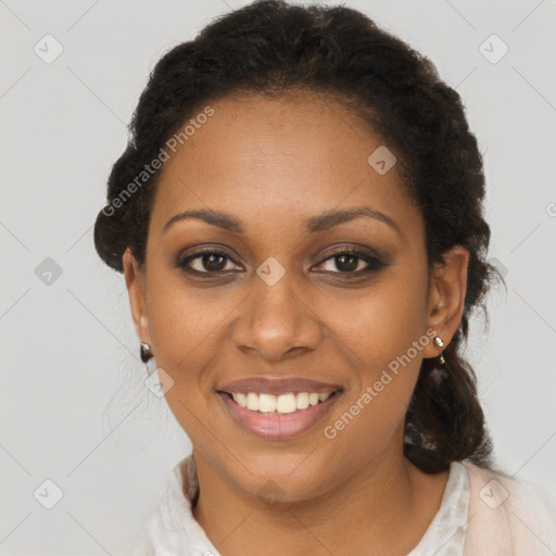 Joyful black young-adult female with short  brown hair and brown eyes