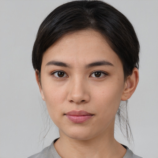 Neutral asian young-adult female with medium  brown hair and brown eyes