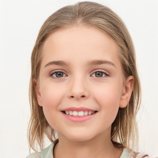 Joyful white child female with medium  brown hair and grey eyes