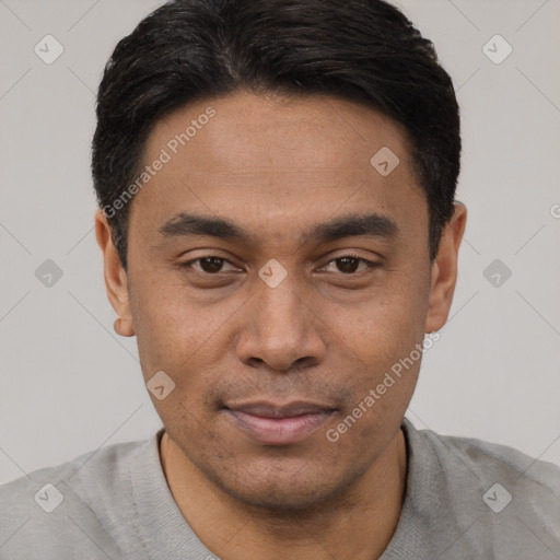 Joyful asian young-adult male with short  black hair and brown eyes