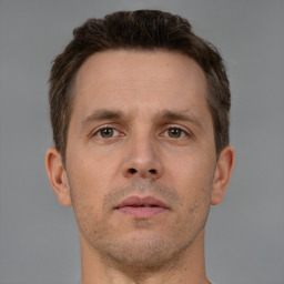 Neutral white adult male with short  brown hair and brown eyes