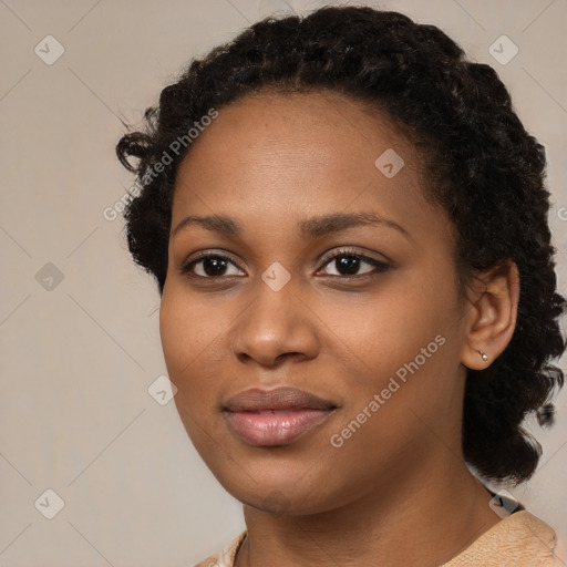 Joyful black young-adult female with medium  black hair and brown eyes