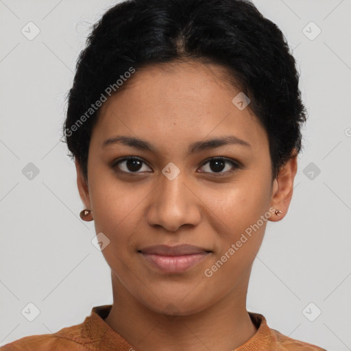 Joyful latino young-adult female with short  black hair and brown eyes