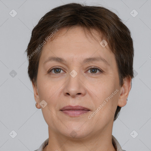 Joyful white adult female with short  brown hair and brown eyes