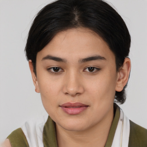 Joyful asian young-adult female with medium  brown hair and brown eyes