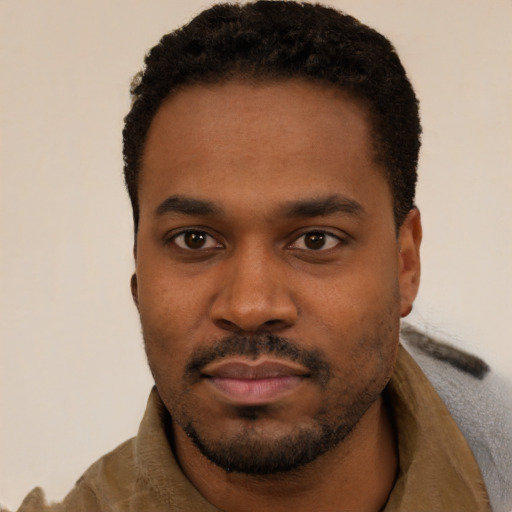 Neutral black young-adult male with short  black hair and brown eyes