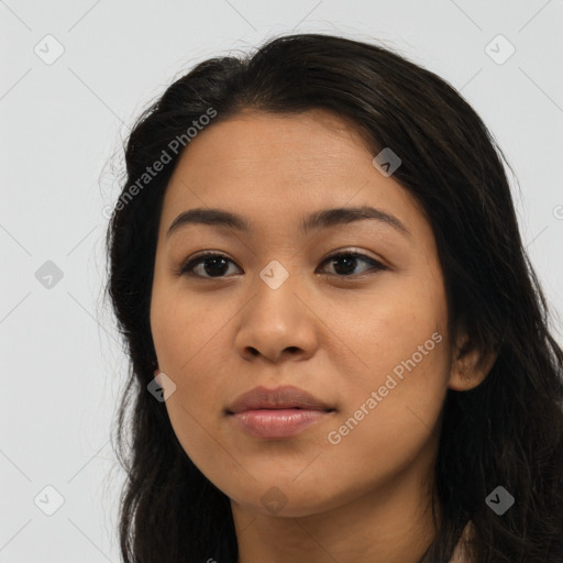 Joyful latino young-adult female with long  black hair and brown eyes