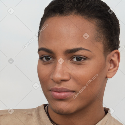 Joyful black young-adult female with short  brown hair and brown eyes