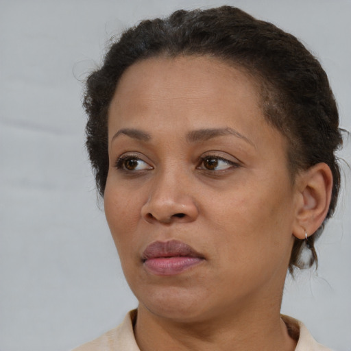 Neutral black adult female with short  brown hair and brown eyes