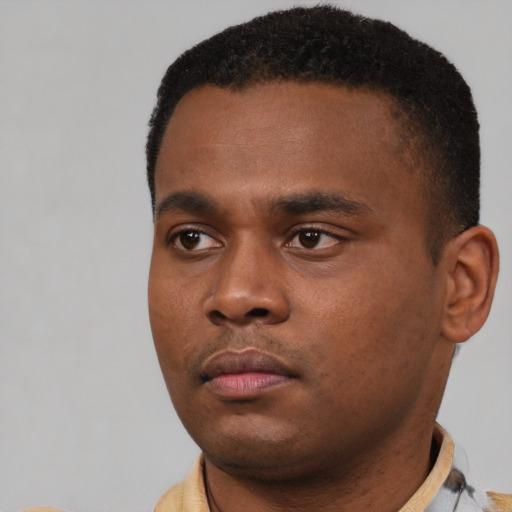 Neutral black young-adult male with short  black hair and brown eyes