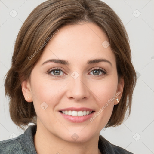 Joyful white young-adult female with medium  brown hair and green eyes