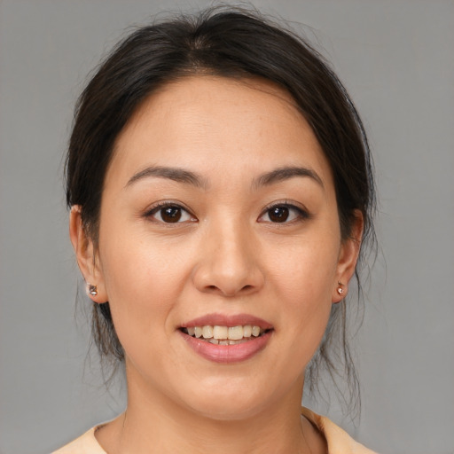 Joyful white young-adult female with medium  brown hair and brown eyes