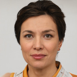 Joyful white adult female with short  brown hair and brown eyes