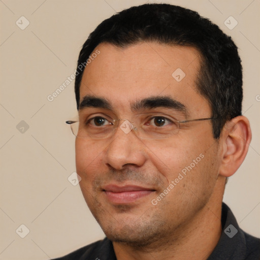 Joyful white adult male with short  black hair and brown eyes