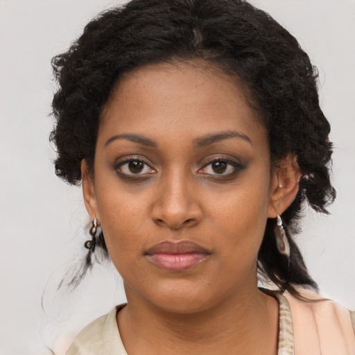 Neutral black young-adult female with long  brown hair and brown eyes