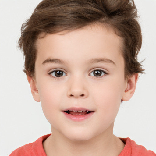 Joyful white child male with short  brown hair and brown eyes