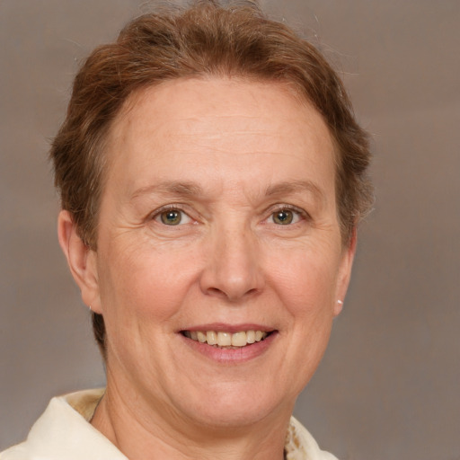 Joyful white middle-aged female with short  brown hair and brown eyes