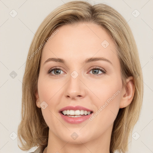 Joyful white young-adult female with long  brown hair and green eyes