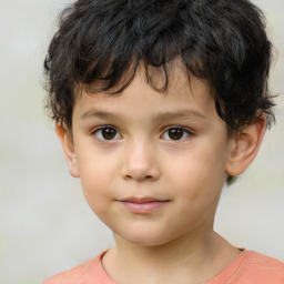 Joyful white child male with short  brown hair and brown eyes