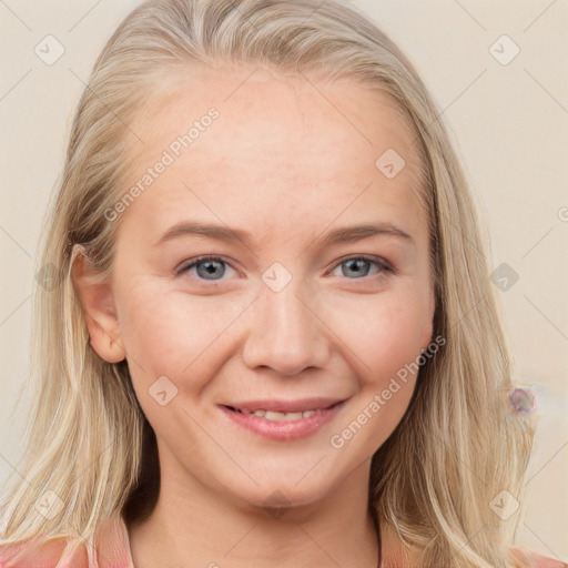 Joyful white young-adult female with long  brown hair and blue eyes