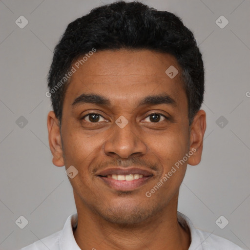 Joyful latino young-adult male with short  black hair and brown eyes