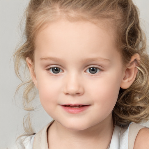 Joyful white child female with medium  brown hair and grey eyes